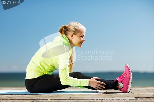 Image of woman doing sports outdoors