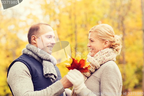 Image of smiling couple in autumn park