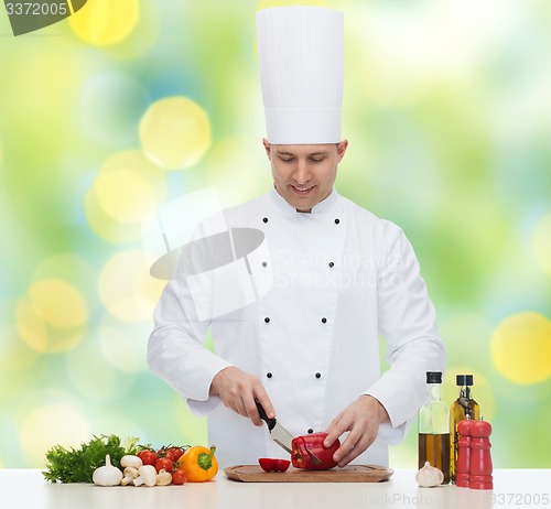 Image of happy male chef cook cooking food