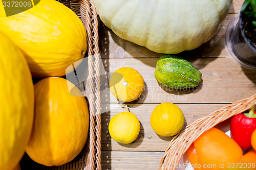 Image of vegetables in baskets on table at market or farm