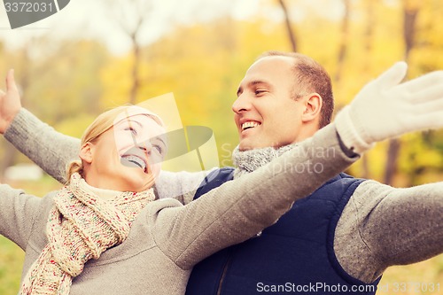 Image of smiling couple in autumn park