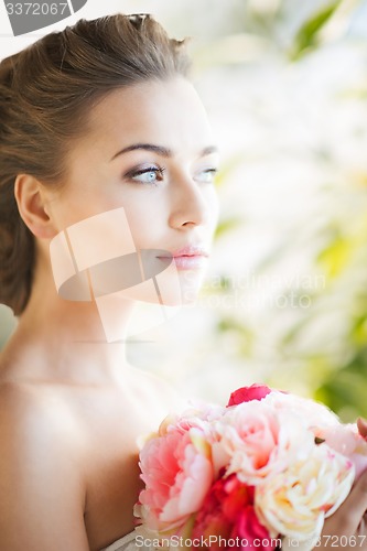 Image of bride with bouquet of flowers