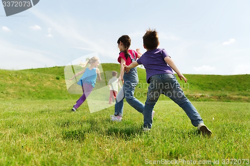 Image of group of happy kids running outdoors