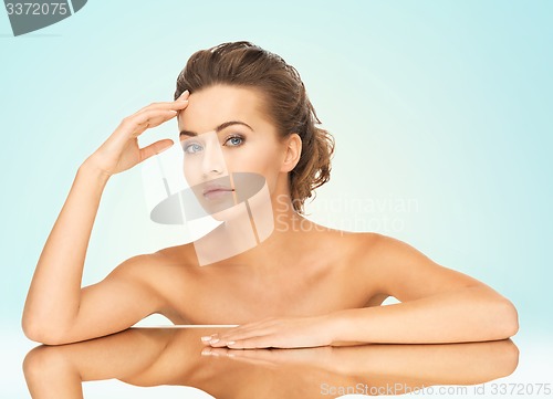 Image of woman with mirror