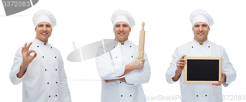 Image of happy male chef baker with menu board showing ok