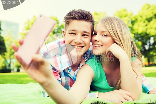 Image of smiling couple in park
