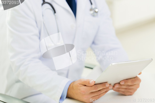 Image of close up of male doctor hands with tablet pc