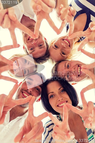 Image of smiling friends in circle