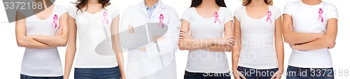 Image of smiling women with pink cancer awareness ribbons