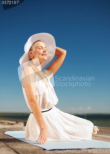 Image of beautiful woman enjoying summer outdoors