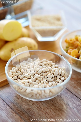 Image of close up of beans in glass bowl on table