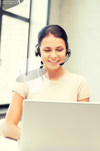 Image of helpline operator with laptop computer