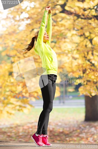 Image of woman doing yoga outdoors
