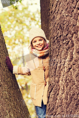 Image of smiling little girl autumn in park