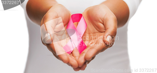 Image of hands holding pink breast cancer awareness ribbon