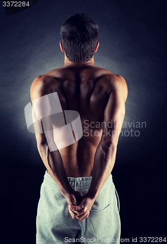 Image of young male bodybuilder from back