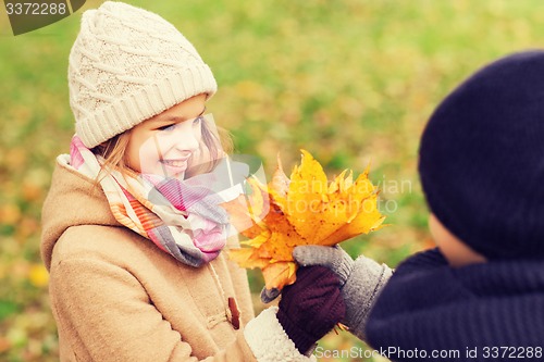 Image of smiling children in autumn park