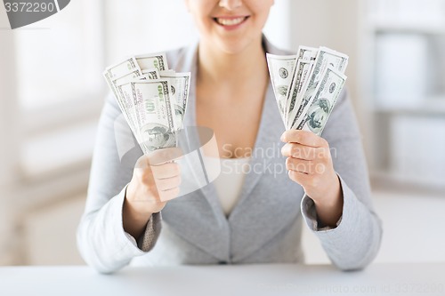 Image of close up of woman hands holding us dollar money