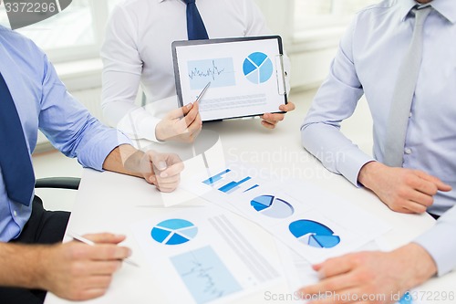 Image of close up of businessman hands with clipboard