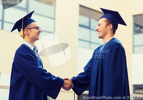 Image of smiling students in mortarboards