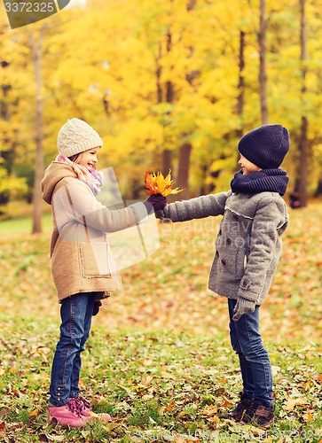 Image of smiling children in autumn park