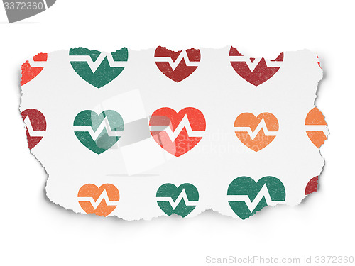 Image of Healthcare concept: Heart icons on Torn Paper background
