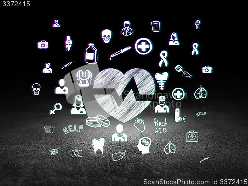 Image of Healthcare concept: Heart in grunge dark room