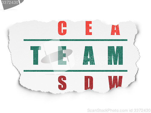 Image of Finance concept: word Team in solving Crossword Puzzle
