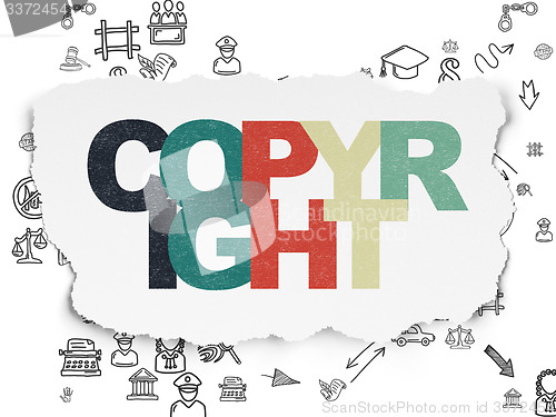 Image of Law concept: Copyright on Torn Paper background