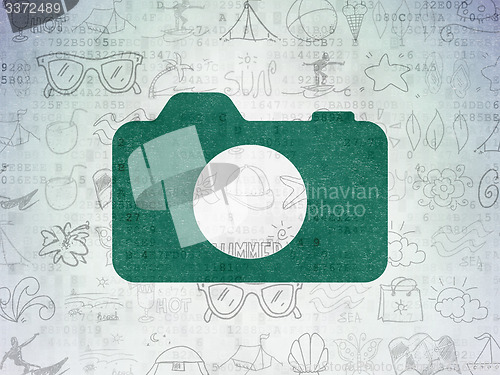 Image of Travel concept: Photo Camera on Digital Paper background