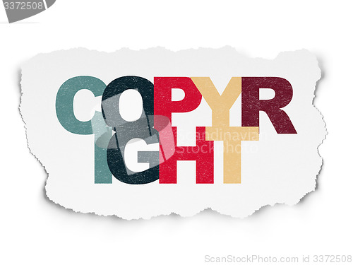 Image of Law concept: Copyright on Torn Paper background