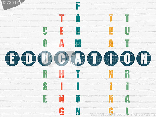 Image of Education concept: word Education in solving Crossword Puzzle