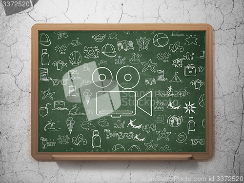 Image of Tourism concept: Camera on School Board background