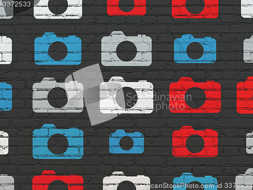 Image of Tourism concept: Photo Camera icons on wall background