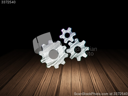 Image of Information concept: Gears in grunge dark room