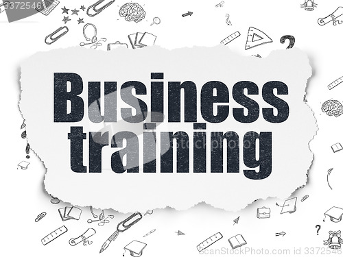 Image of Learning concept: Business Training on Torn Paper background