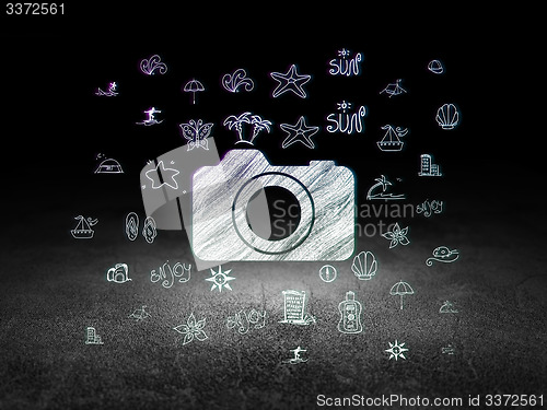 Image of Vacation concept: Photo Camera in grunge dark room