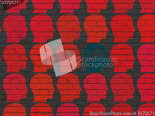 Image of Learning concept: head with gears icon on wall background