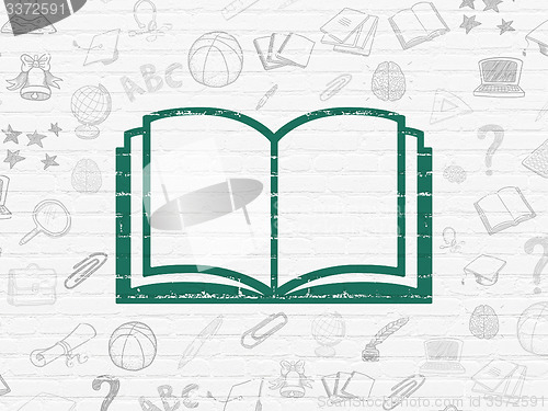 Image of Education concept: Book on wall background