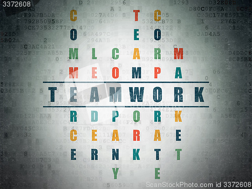 Image of Business concept: word Teamwork in solving Crossword Puzzle