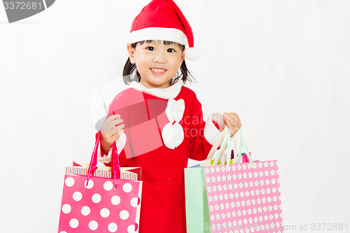 Image of Asian Little Santa Claus with shopping bag