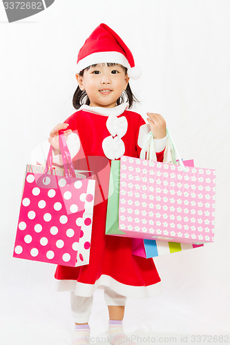 Image of Asian Little Santa Claus with shopping bag