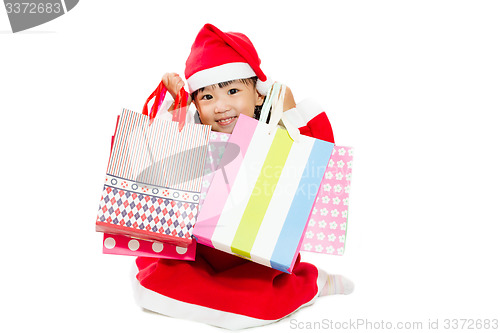 Image of Asian Little Santa Claus with shopping bag