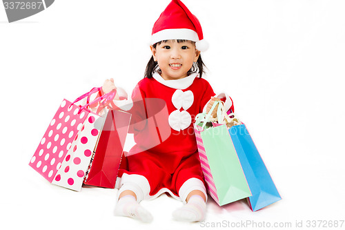 Image of Asian Little Santa Claus with shopping bag