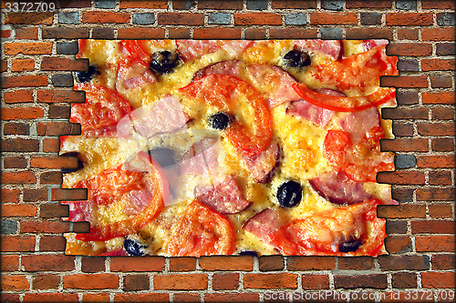 Image of broken brick wall and view to tasty pizza