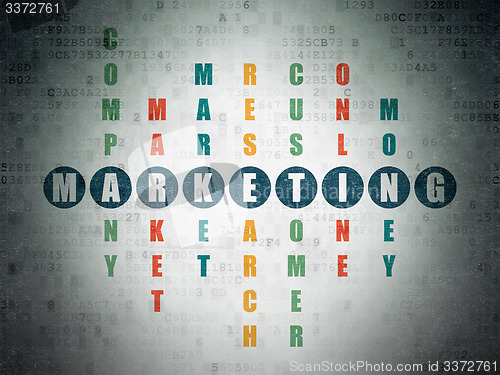 Image of Advertising concept: word Marketing in solving Crossword Puzzle