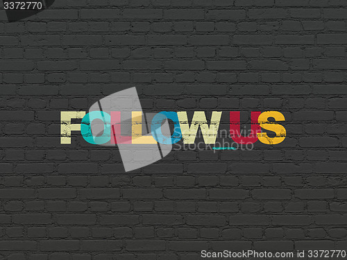 Image of Social network concept: Follow us on wall background