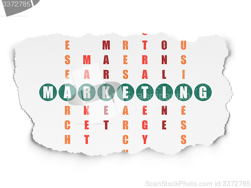 Image of Advertising concept: word Marketing in solving Crossword Puzzle