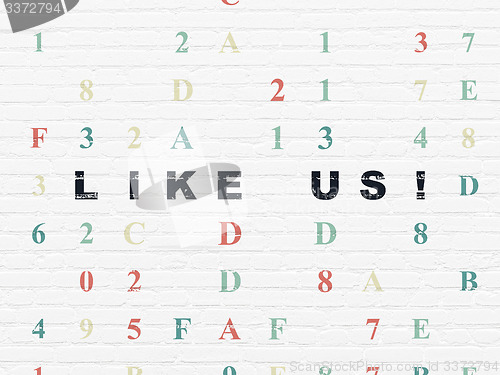 Image of Social media concept: Like us! on wall background