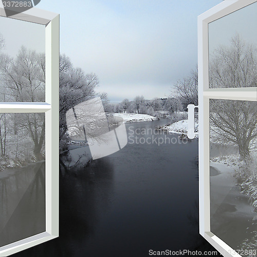 Image of open window to the winter river